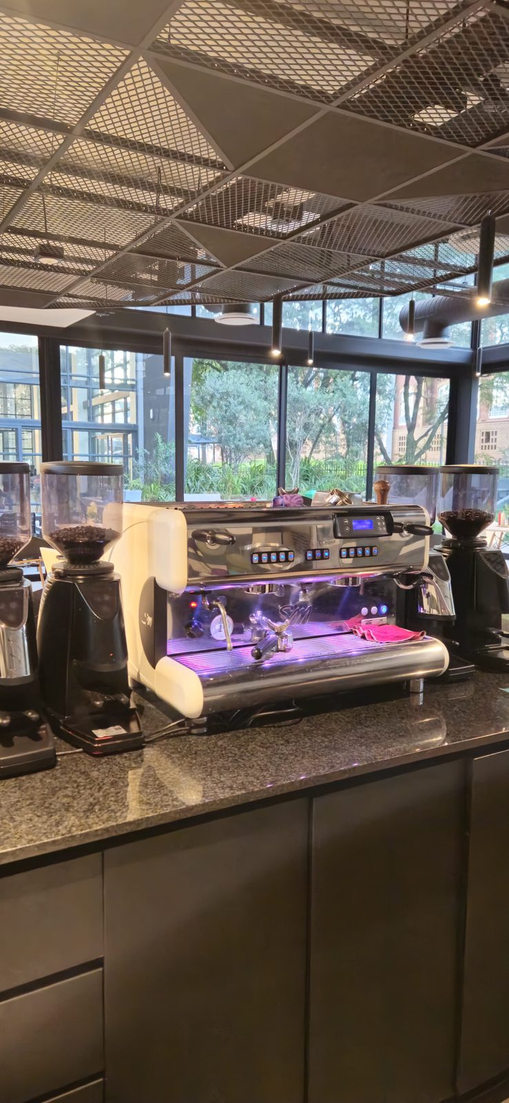 The espresso bar with garden views behind it